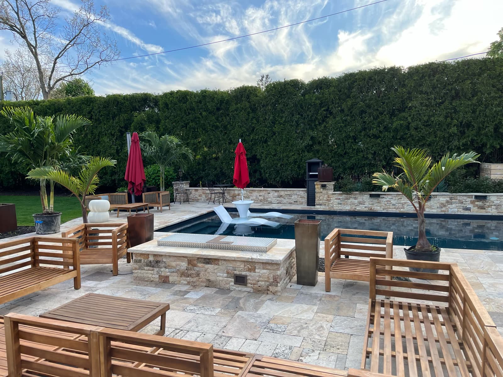 Suffolk Palms installation around a Long Island pool